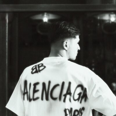 Fashionable black and white photo of a male model wearing a Balenciaga T-shirt.