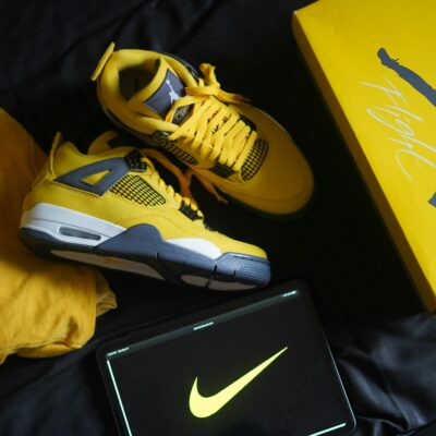 Yellow sneakers with matching box and logo create a bold fashion statement.